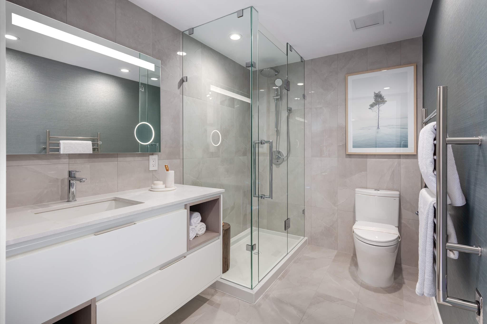 Artesia bathroom with floating vanity and frameless glass shower